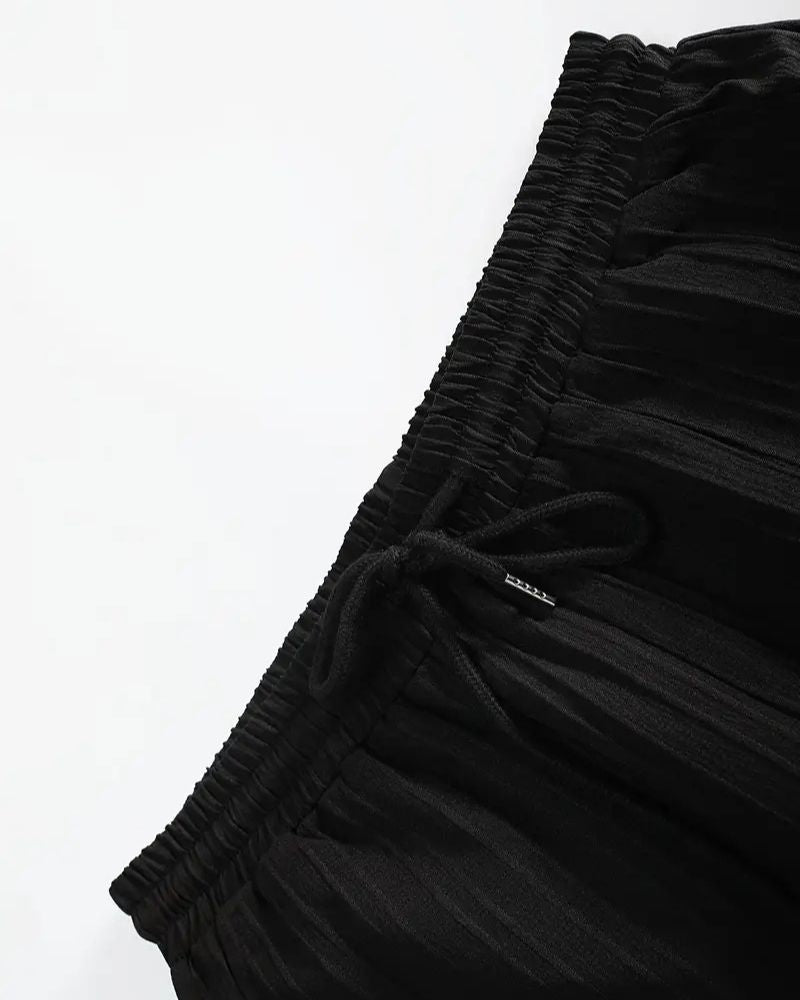 Black fabric with a textured pattern on a white background