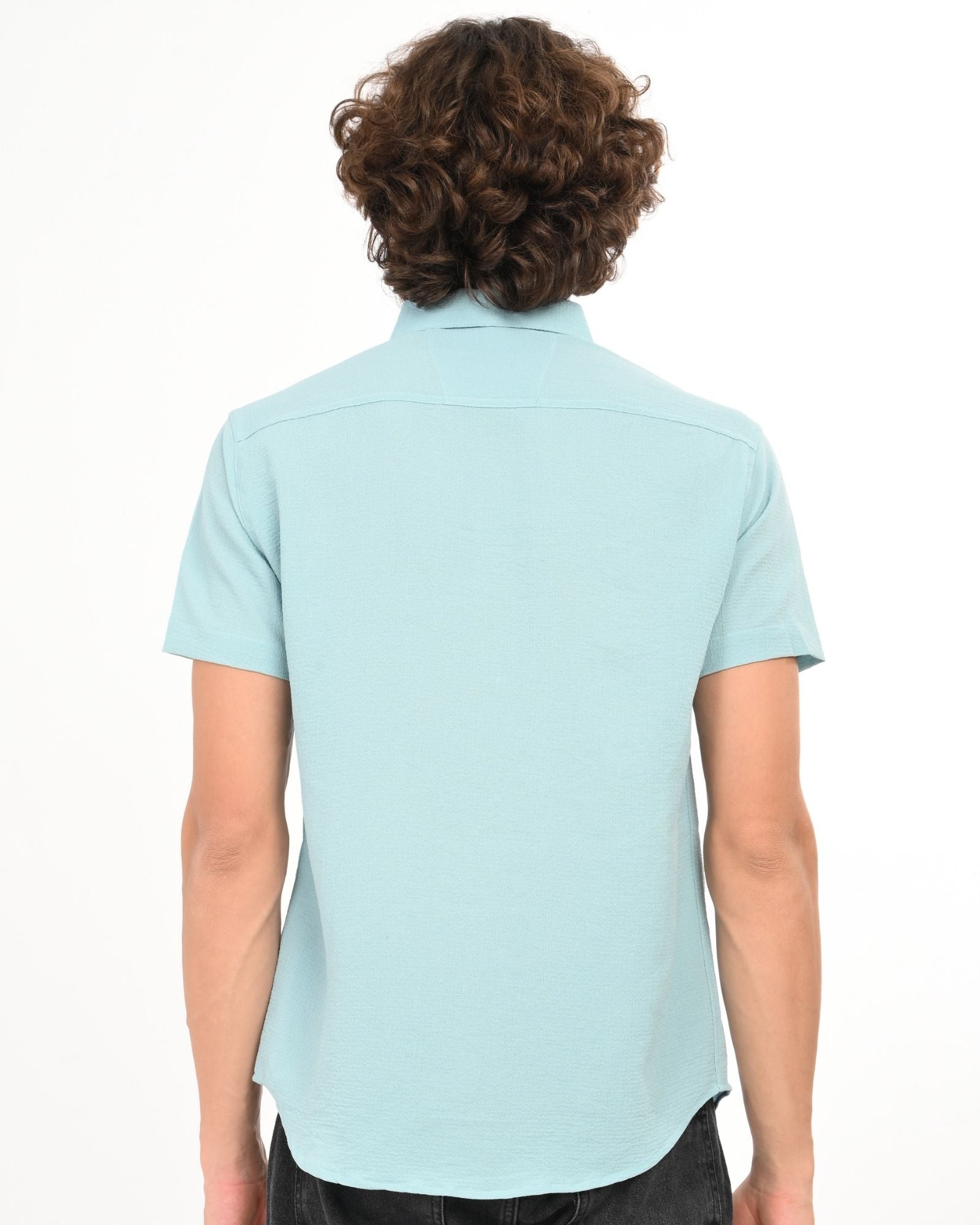 Back view of light blue textured short sleeve button-up shirt for men