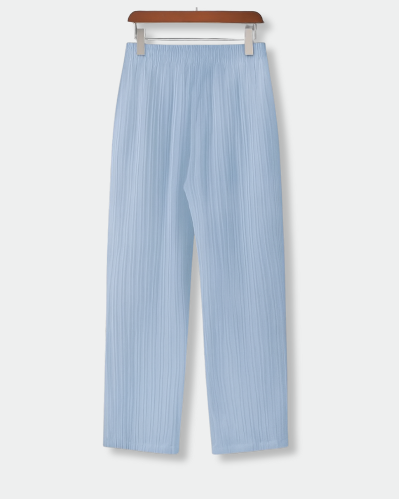Back view of men's airy fit light blue drawstring trousers with elastic waistband