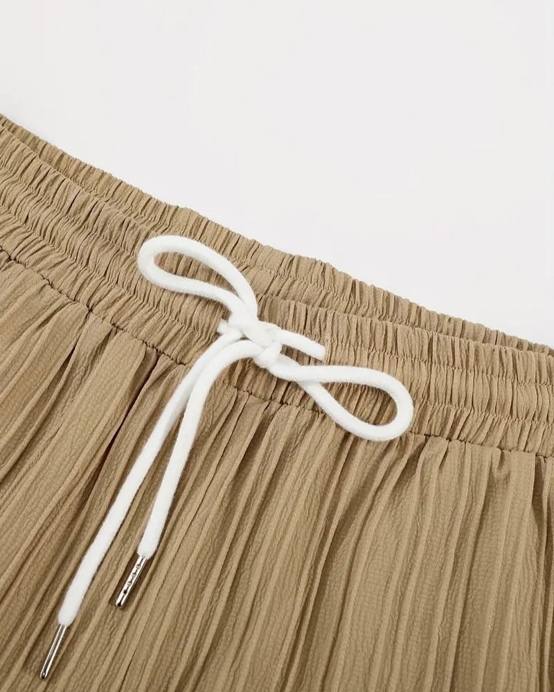 Close-up of waistband and drawstring on beige shorts