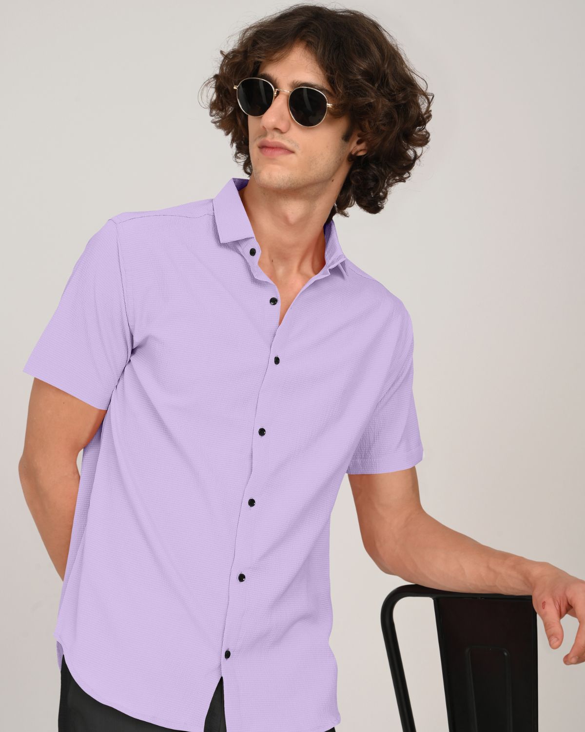 Close-up side pose in men’s lilac textured short sleeve shirt