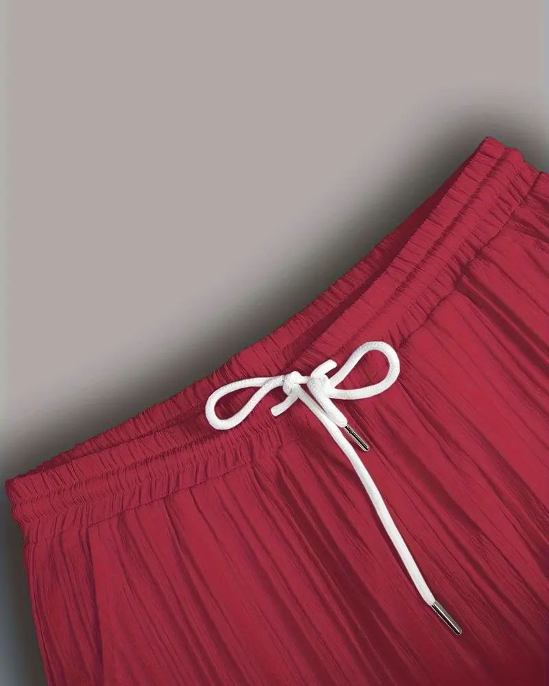 Drawstring waistband detail on burgundy sugarcane pants