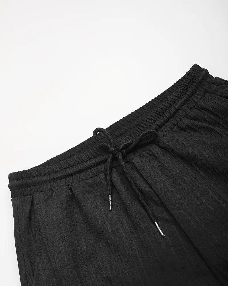 Elastic waistband with black drawstring on lightweight men’s pants