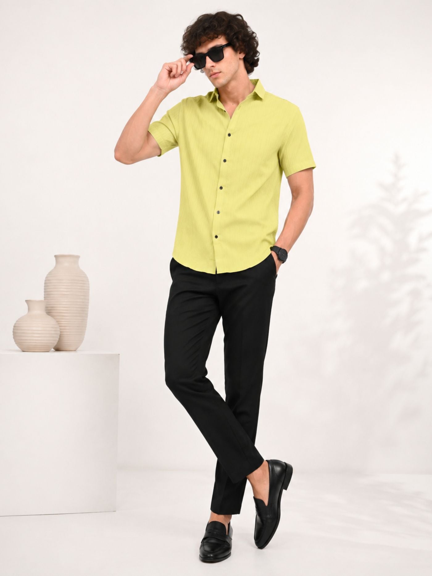 Full-length model wearing Lime Zest air-texture shirt with black trousers