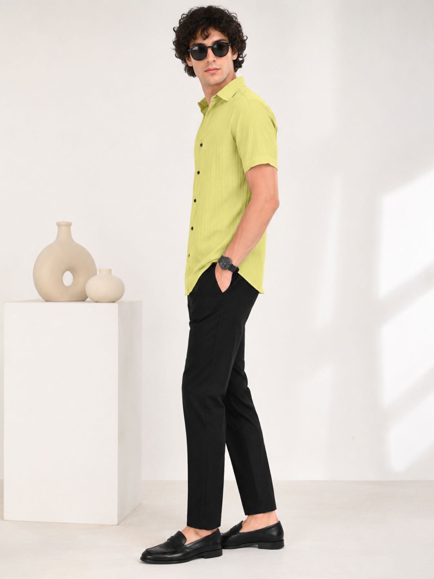 Male model wearing Lime Zest textured shirt with black trousers and loafers