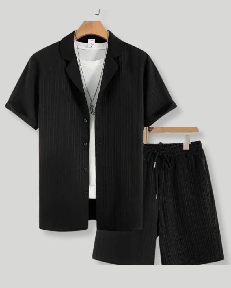 Black shirt and black shorts set on a gray background