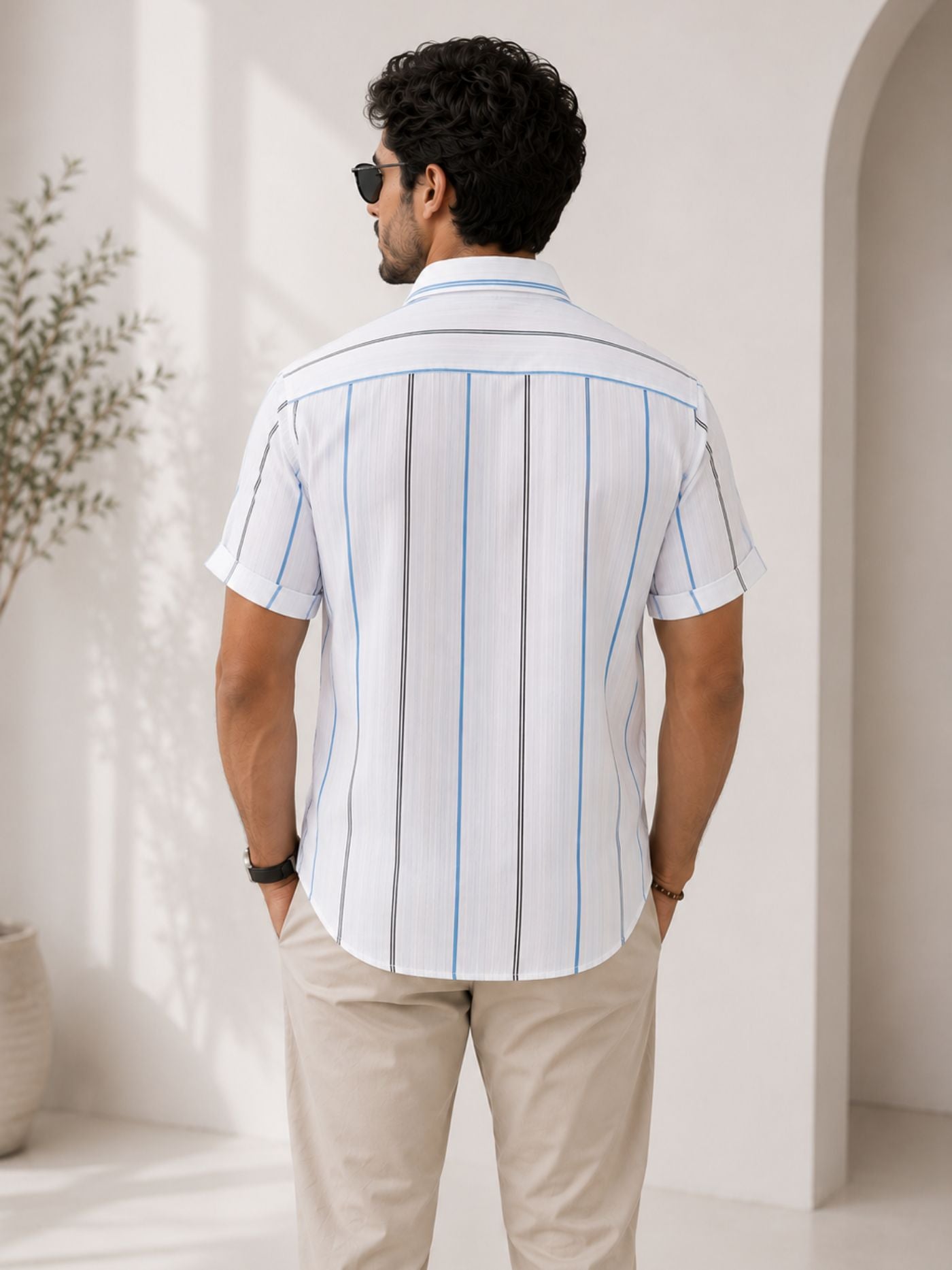 Men's white resort collar striped shirt styled for a smart casual look.