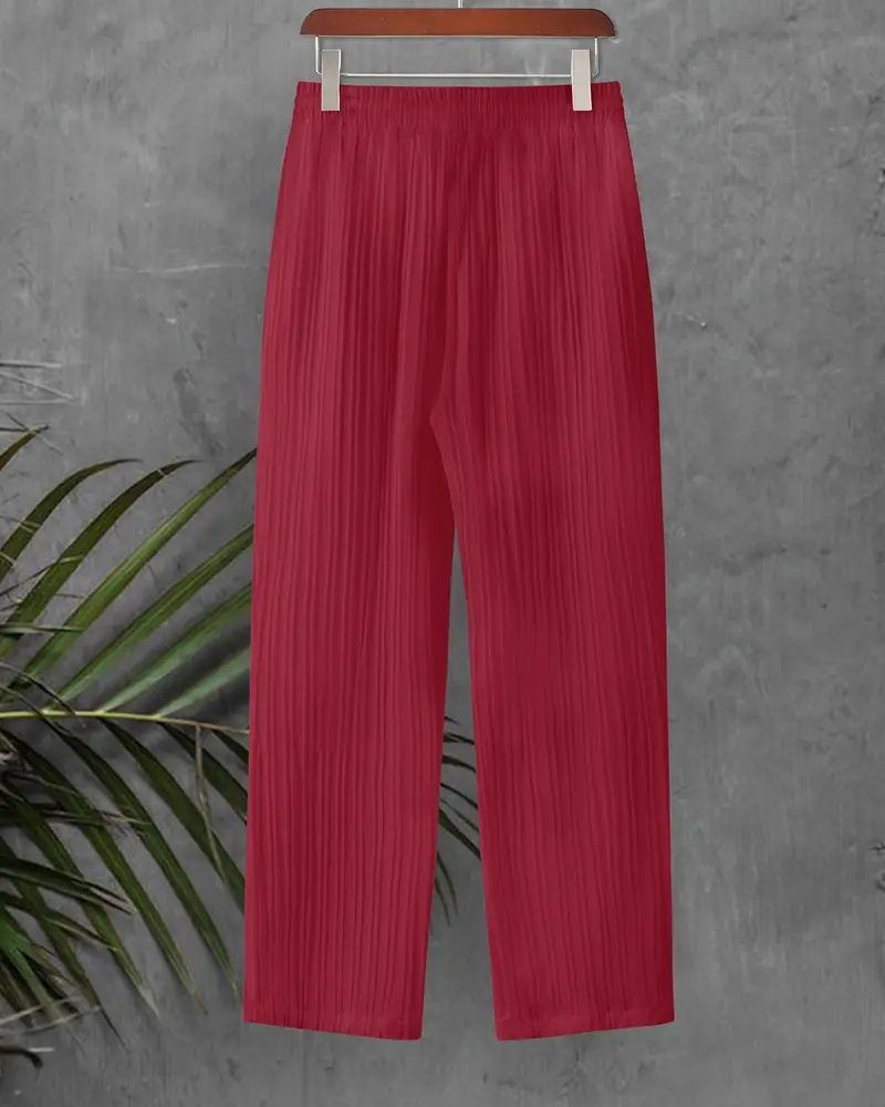 Relaxed fit sustainable pants hanging on hanger