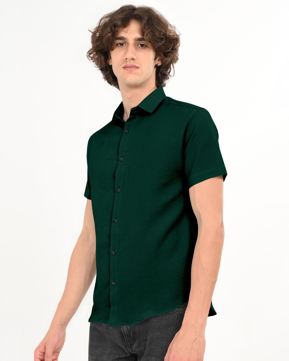 Side pose in men’s dark green casual short sleeve shirt