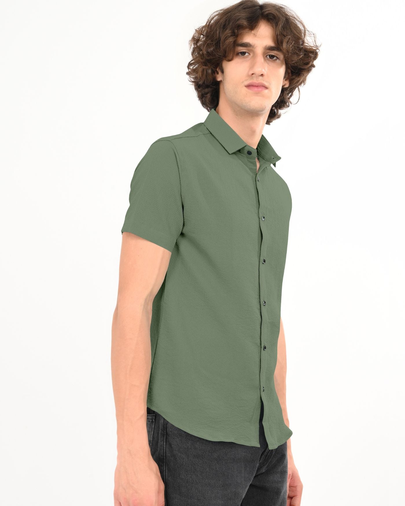 Side view of men’s olive green crinkle textured short sleeve shirt