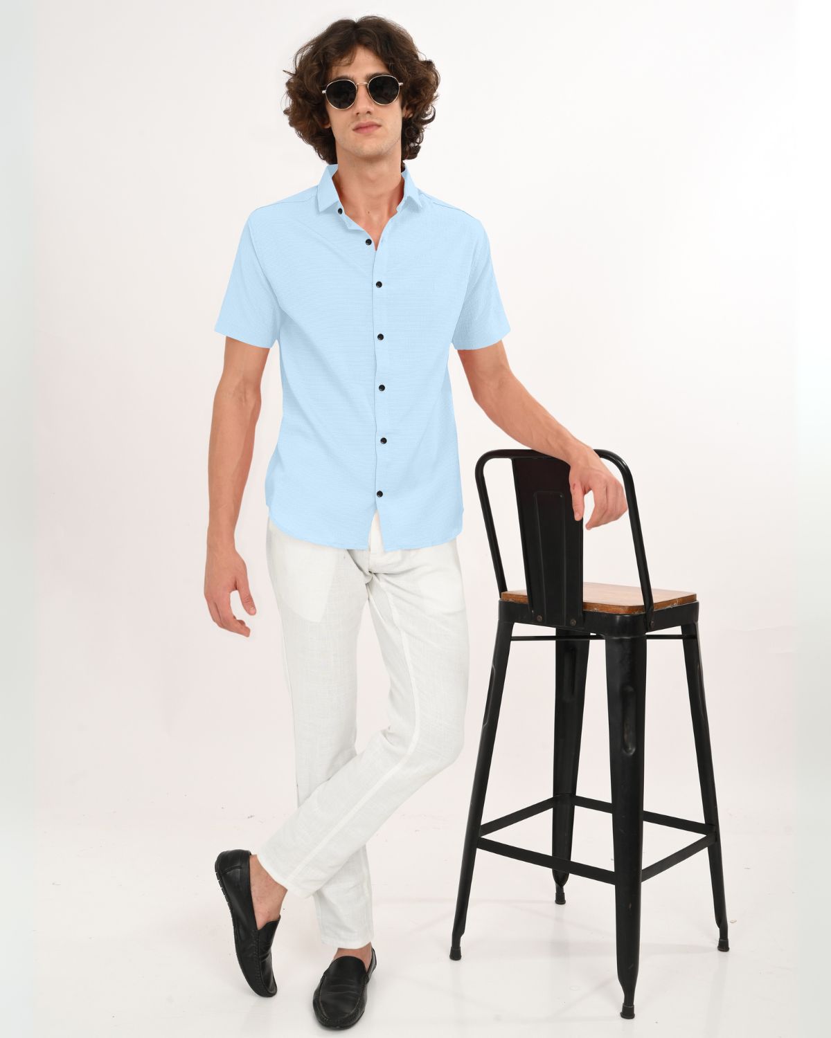 Man wearing sky blue crinkle short sleeve shirt front view