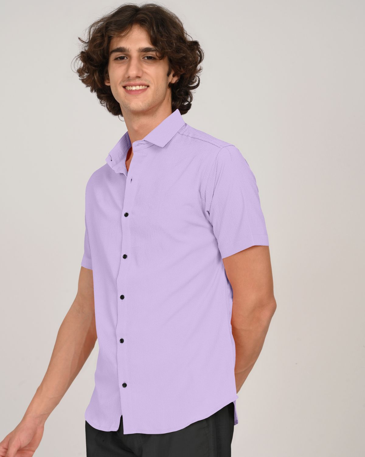 Smiling model in lilac textured short sleeve shirt front view