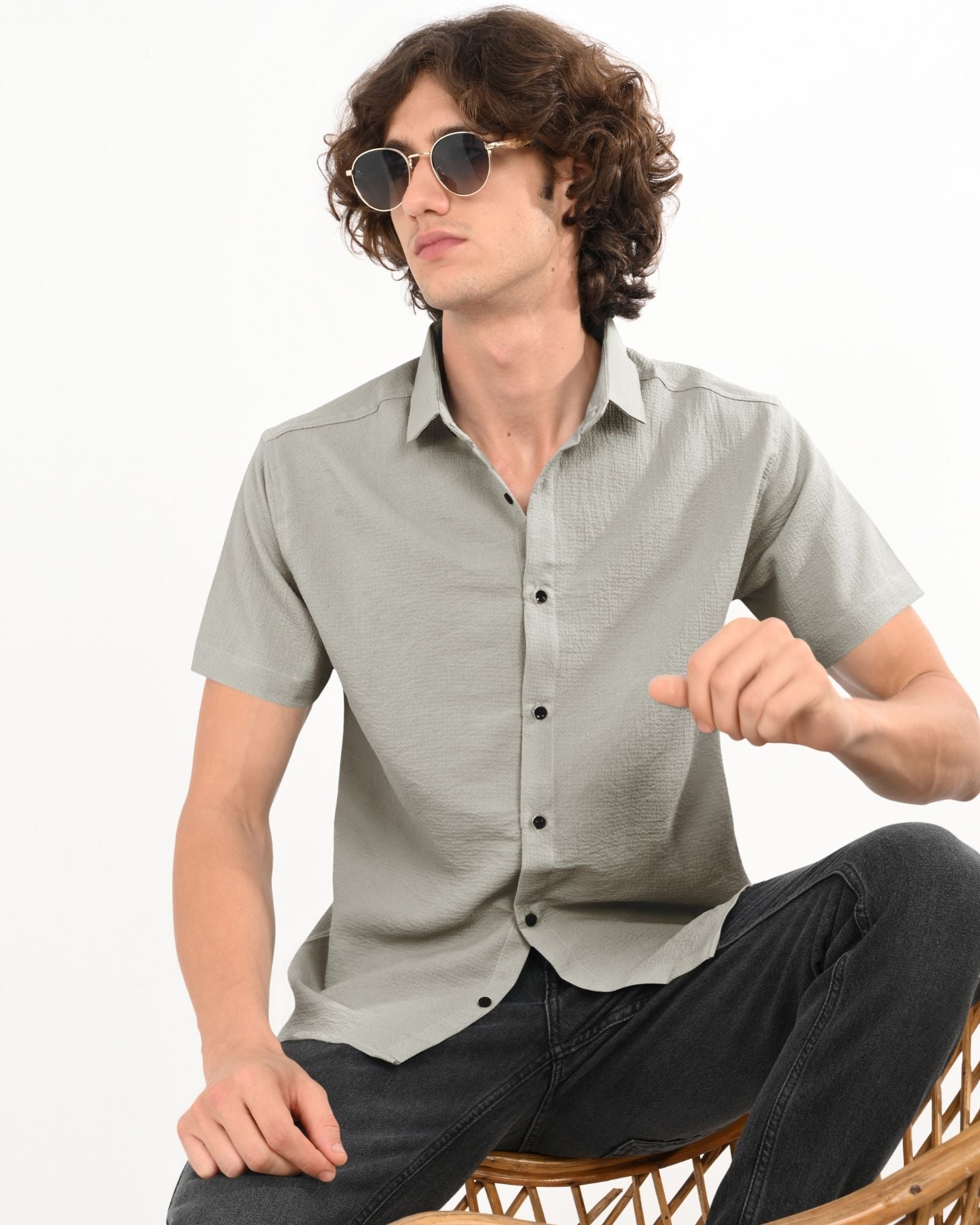 Stylish men’s grey textured short sleeve button-up shirt paired with black jeans