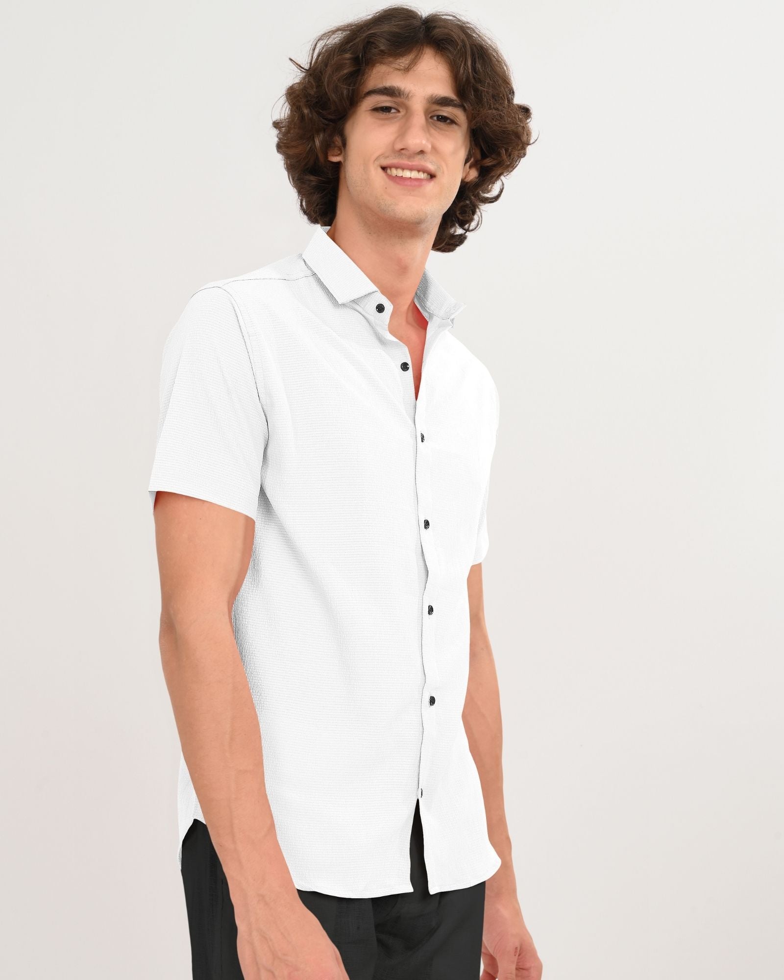 Angled front view of men’s white short sleeve button-down shirt