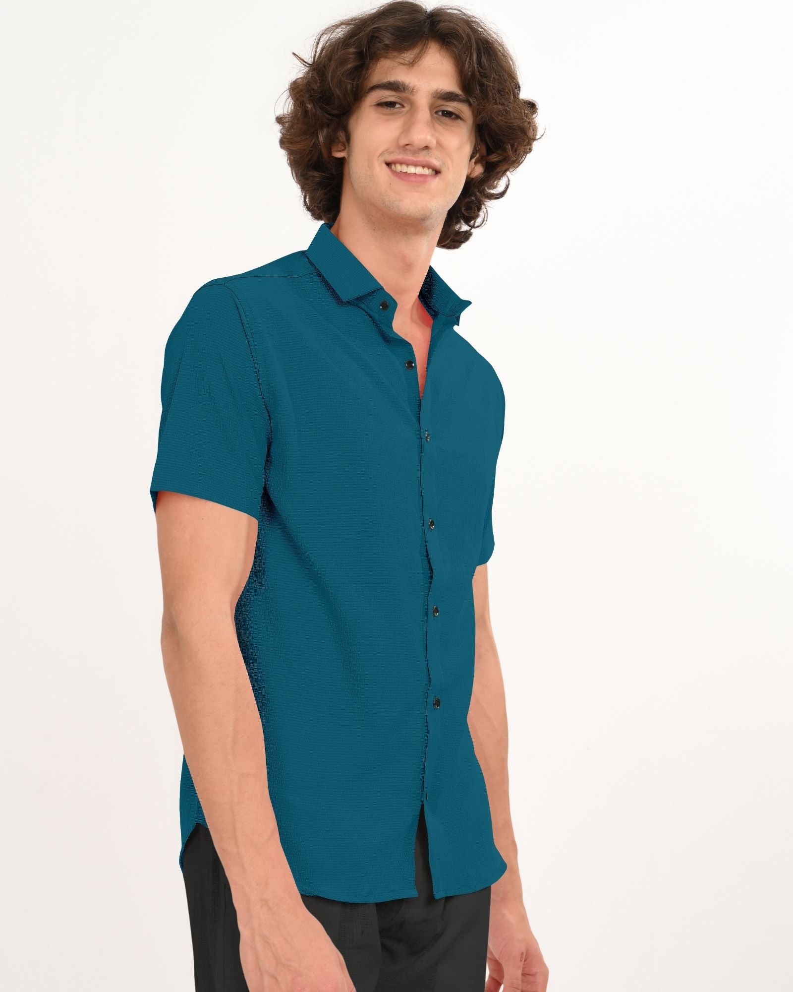 Angled front view of teal men’s short sleeve button-down shirt