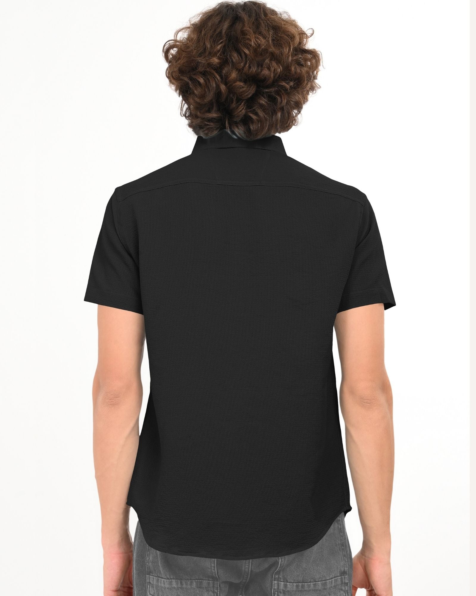 Back view of black textured short-sleeve shirt