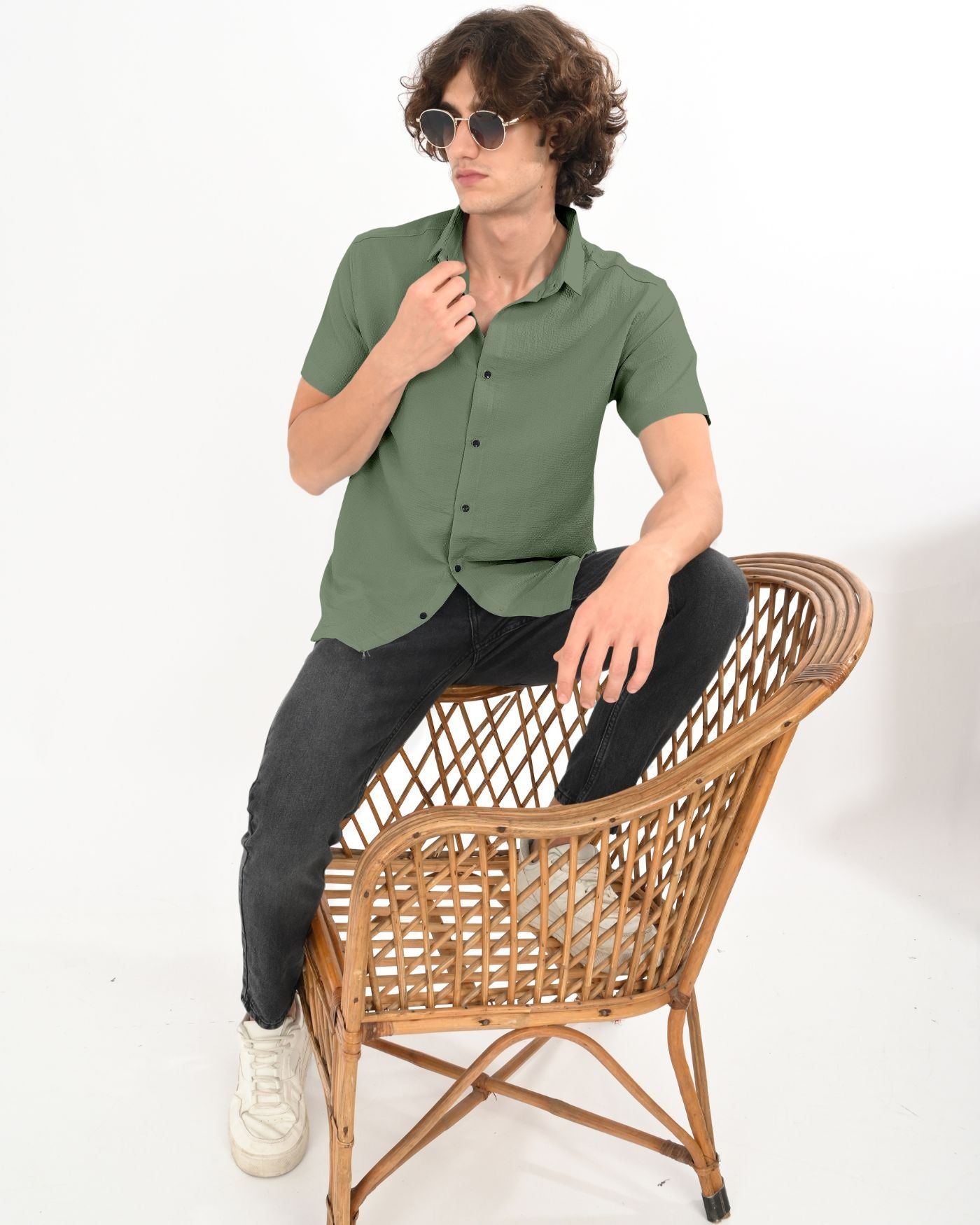 Casual look in olive green crinkle textured shirt and black jeans