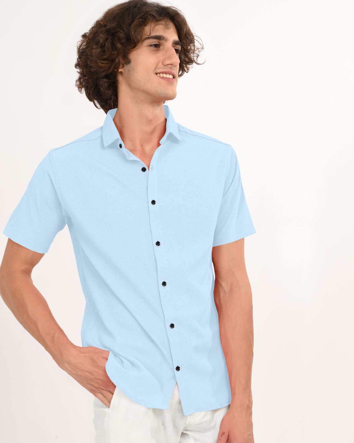 Casual look in sky blue crinkle shirt with white pants