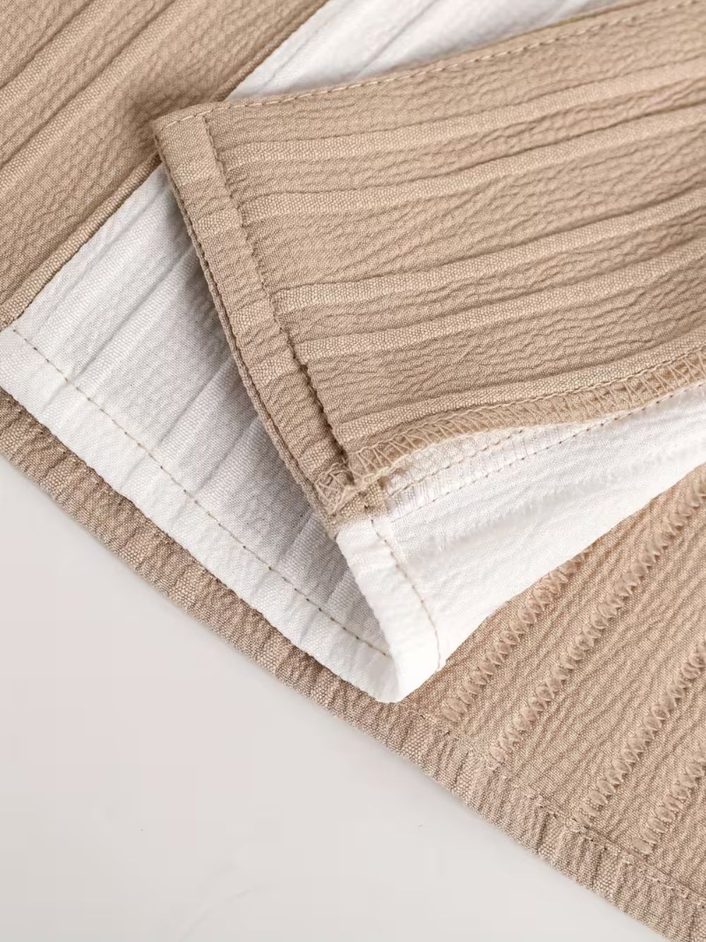 Close up of premium breathable fabric texture used in sand edition street shirt for men