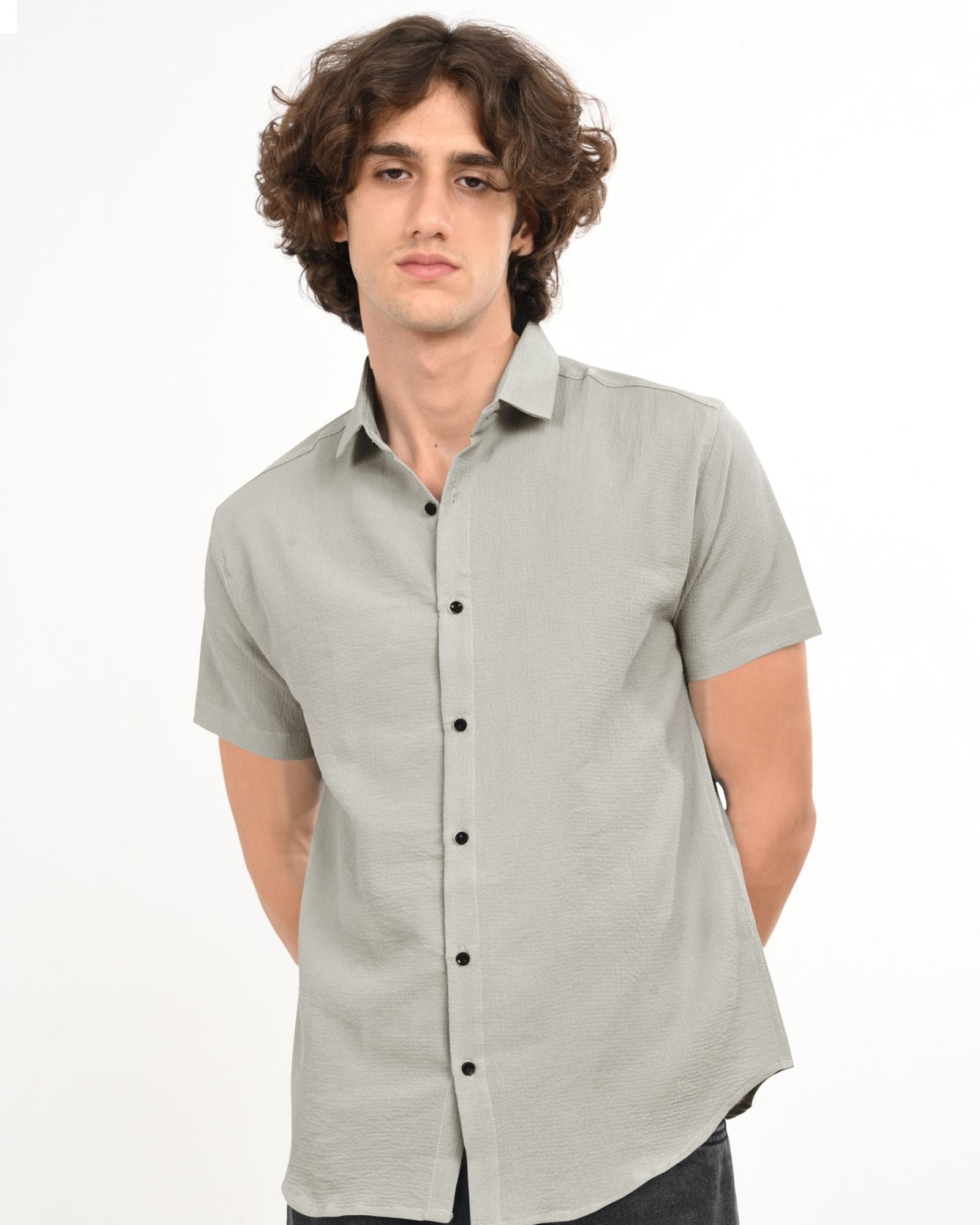 Front view of men’s grey textured short sleeve shirt with button-down style