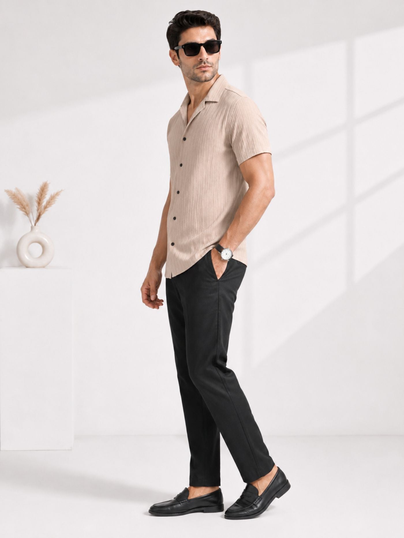 Full-length side view of male model wearing sand beige textured shirt