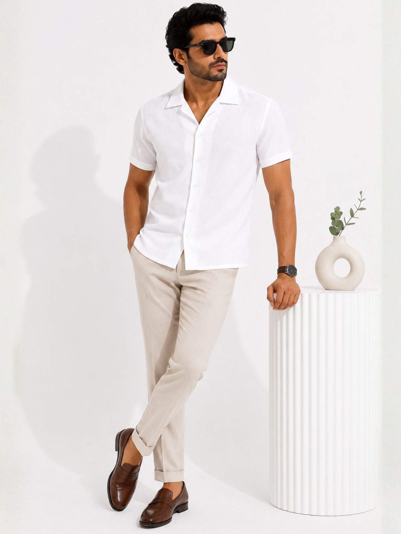 Male model in the Lucent Pure White Cuban Collar Shirt styled for resort and smart-casual wear