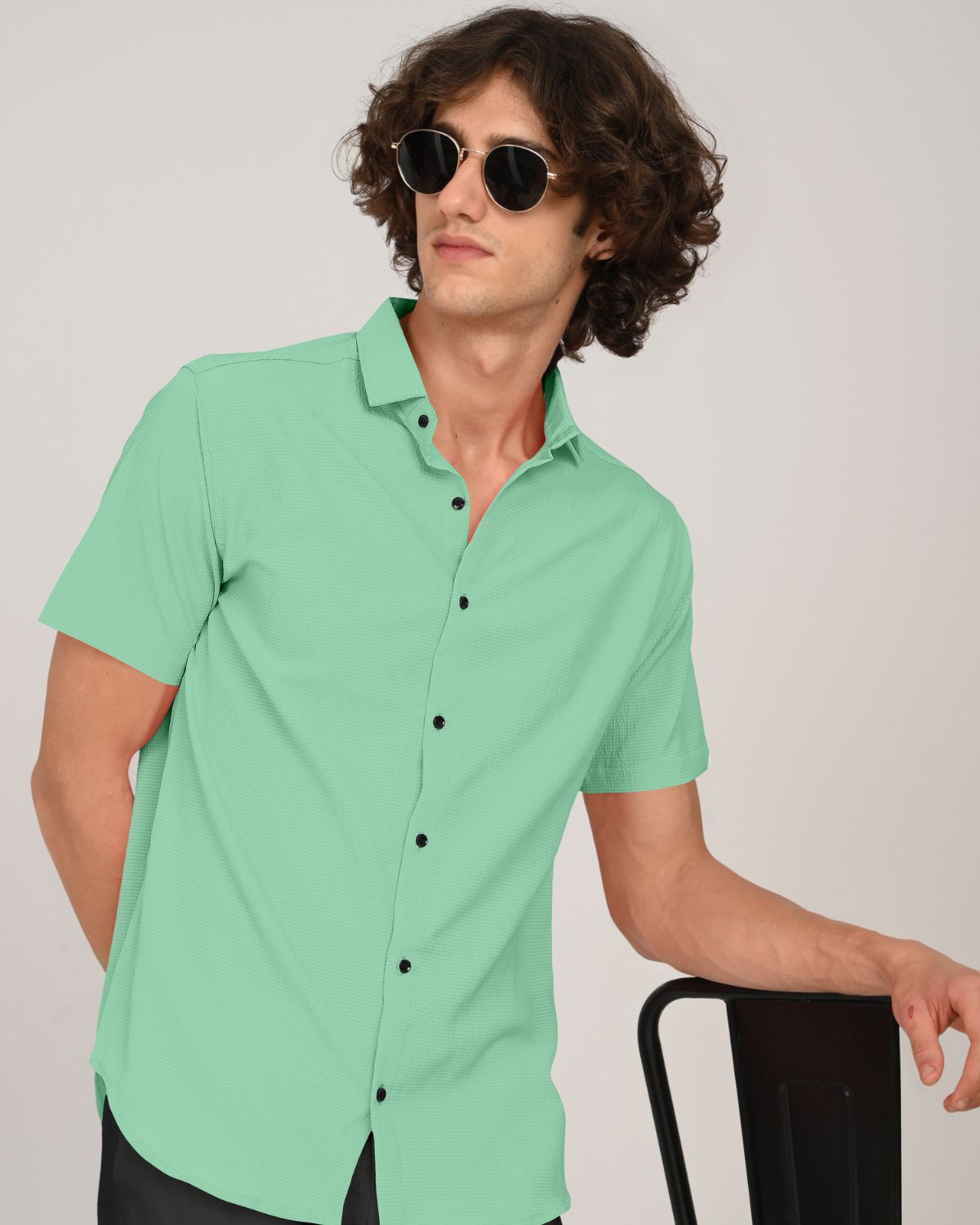 Man wearing mint green textured short sleeve shirt front view