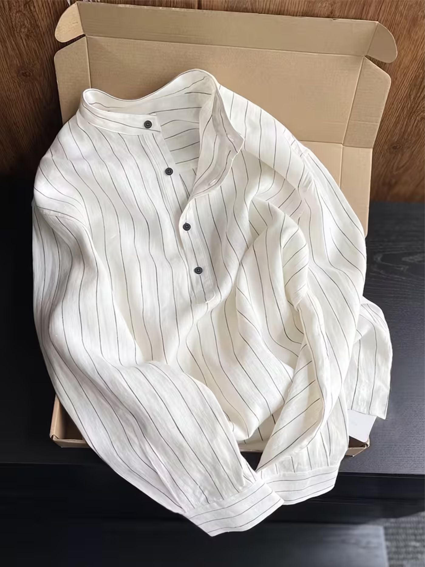 Men's white pinstripe shirt with a half-button placket.