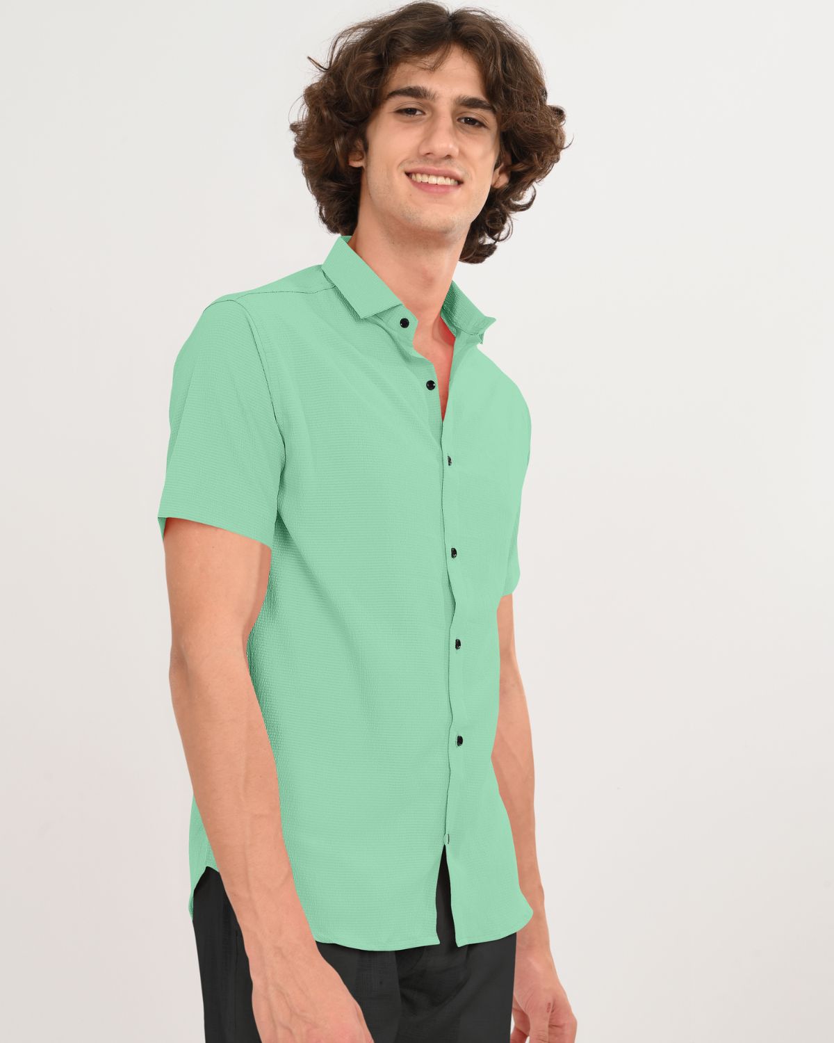 Mint green textured shirt side angle on model