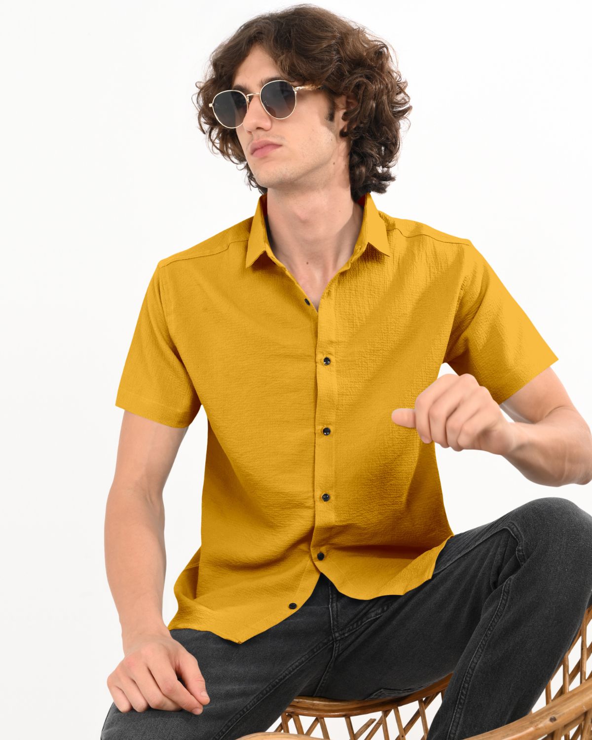 Model in mustard crinkle shirt with sunglasses