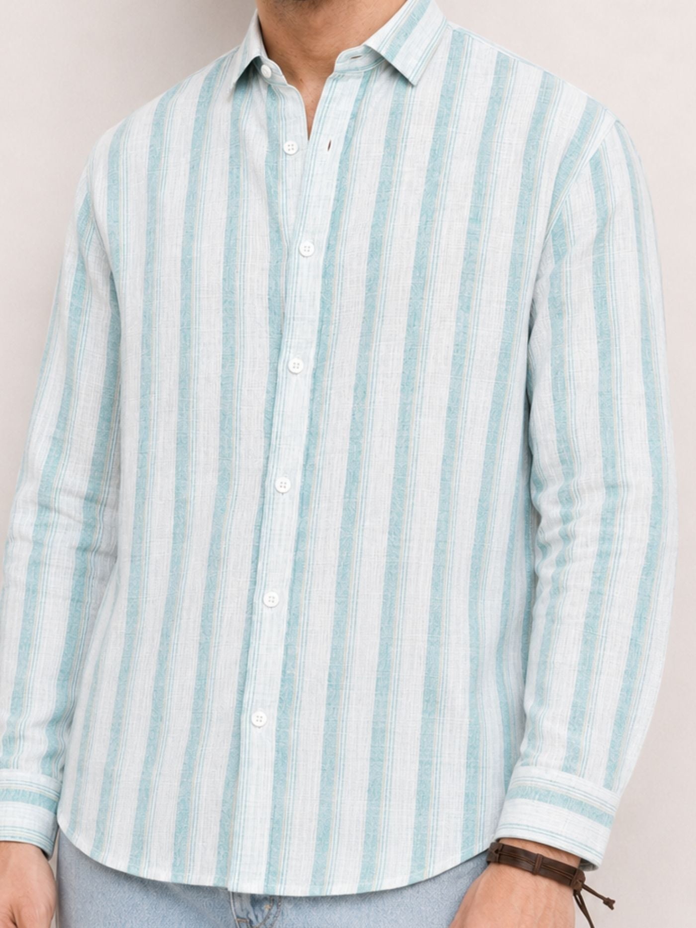 Close-up of aqua blue and white striped shirt fabric, collar and buttons
